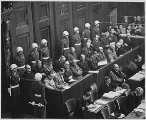 Nuremberg Trials. Looking down on defendants dock with guards behind.